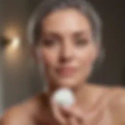 Serene mature woman applying skincare product