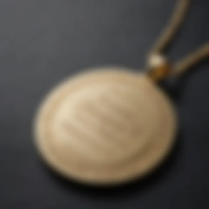 Close-up of a name engraved on a gold necklace