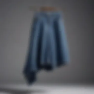 Denim skirt draped elegantly on a hanger