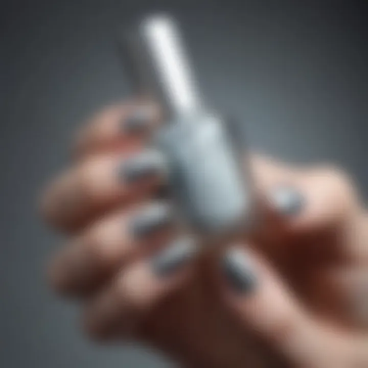 A close-up shot showcasing the shimmer of Essie Silver Nail Polish.