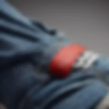 Close-up of high-waisted baggy jeans paired with stylish sneakers