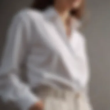 Minimalist white cotton blouse paired with tailored trousers