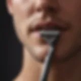 Meticulous Razor Stubble Removal Silhouette of a razor against a radiant background