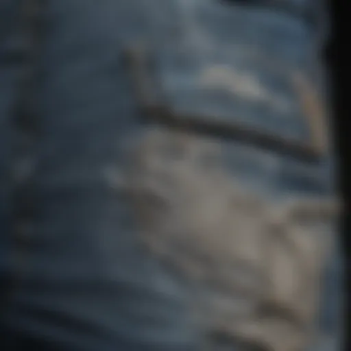 A close-up view of super distressed jeans showcasing intricate tear patterns.