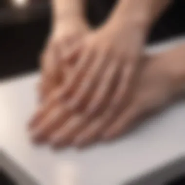 An elegant display of large fake nails in a salon setting, illustrating the application process.