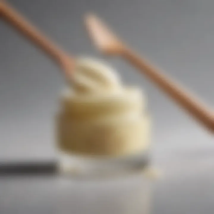 Close-up of a rich, creamy cleansing balm with a wooden spatula.