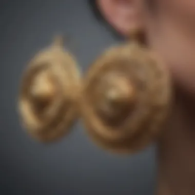 Close-up of intricate chunky gold earrings showcasing detailed craftsmanship