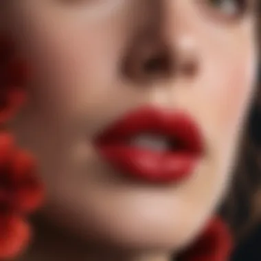 Close-up of a red matte lipstick bullet with intricate floral design